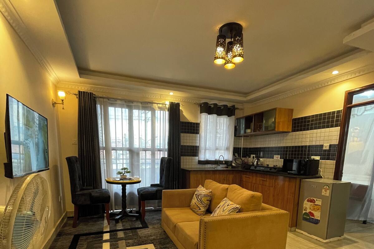 Premium Apartment, 1 Bedroom, Balcony | Living area | 55-inch Smart TV with digital channels, TV, heated floors