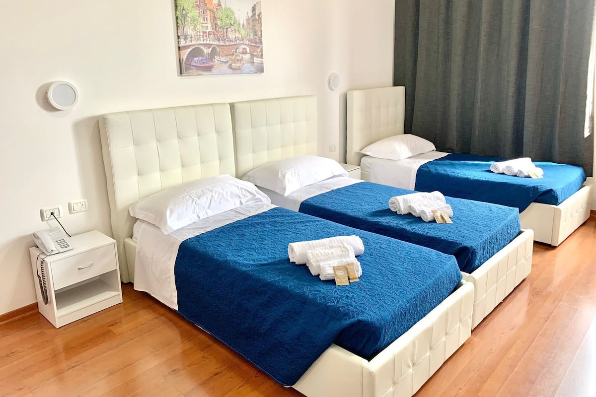 Triple Room | Down comforters, desk, laptop workspace, blackout drapes