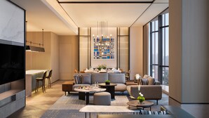 A modern living room with a sofa, coffee table, and ottoman, a dining area with a table and chairs, and a large window providing a view of the city. - Sheraton Xi'An Chanba (Xi'an)