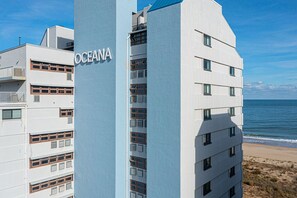 Exterior - Spacious, comfortable 2 bedroom oceanfront condo with free WiFi, an outdoor pool, and an enclosed balcony with a great ocean view located midtown only steps to the beach! (Ocean City)