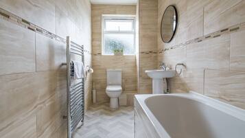 Combined shower/tub, hair dryer, towels, toilet paper