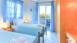 A bedroom with two beds, a balcony with a chair, and a wooden ceiling. - Theophilos 2 in (Corfu)