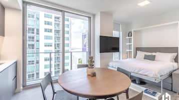 Desk, laptop workspace, iron/ironing board, travel crib