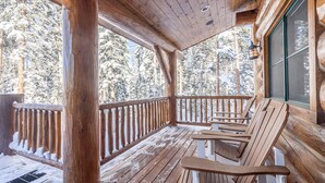 A wooden deck with benches, a railing, and a view of snow-covered trees. - BEARPAW MANOR- A Magnificent Ski-In/Ski-Out Mountain Village Chalet (Mountain Village)