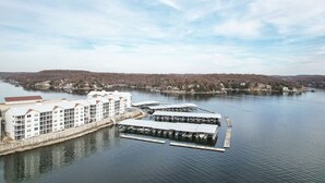 A waterfront hotel with multiple buildings and docked boats.