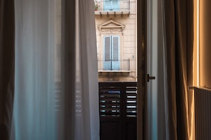 Deluxe Room, 1 Bedroom, Balcony | Minibar, in-room safe, individually decorated, individually furnished
