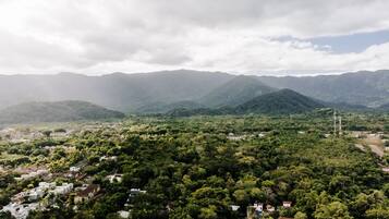 A mountainous landscape with a small settlement.