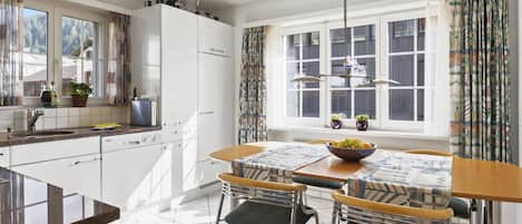 Fridge, dishwasher, highchair, cookware/dishes/utensils