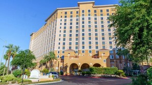 A large, multi-story hotel with a symmetrical facade, numerous windows, and a central entrance with a canopy. - Spend Christmas in this luxurious condo in Vegas! (Las Vegas)