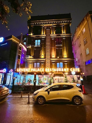 A building with a sign reading "Levent Palace Restaurant Cafe". - Levent Palace Hotel (Istanbul)
