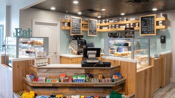 Enjoy a warm and inviting atmosphere at this cozy coffee shop, where a variety of coffee and baked goods are always available. at Bluegreens Bayside Resort and Spa