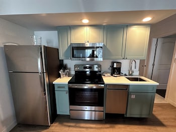 Enjoy cooking in this well-equipped kitchen with a refrigerator, oven, microwave, and dishwasher. at Bluegreens Bayside Resort and Spa