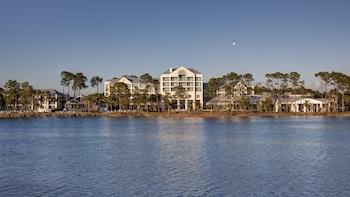 Stunning waterfront hotel with a grand central entrance and serene surroundings. at Bluegreens Bayside Resort and Spa