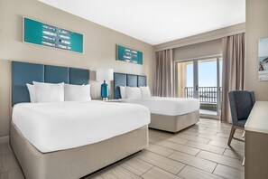 A hotel room with two beds, a desk, a chair, and a balcony with a view. - Hilton Vacation Club Bayside Resort Panama City Beach (Panama City Beach)