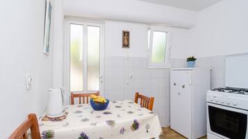 Studio (Studio Apartment with Terrace) | Private kitchen | Fridge, dining tables