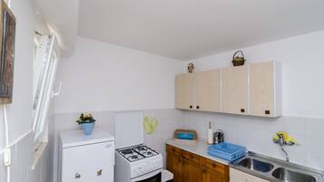 Studio (Studio Apartment with Terrace) | Private kitchen | Fridge, dining tables