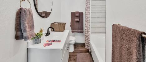 Combined shower/tub, hair dryer, towels, soap