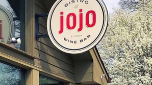 A bistro and wine bar sign with the name "Jojo" and the establishment year "2004". - *Posh 2BR in the Heart of the Pittsford Village* (Pittsford)