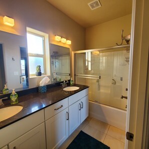 Combined shower/tub, hair dryer, towels, soap