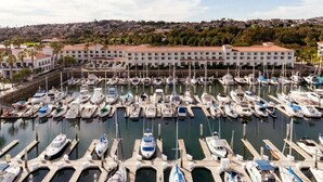 A marina with numerous boats docked at the piers.