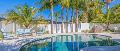 A heated pool, sun loungers