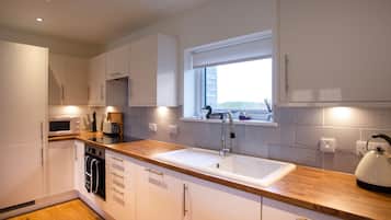 Fridge, dishwasher, electric kettle, cookware/dishes/utensils