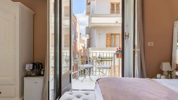 Habitación Deluxe | Ropa de cama hipoalergénica, edredón y camas con efecto memoria