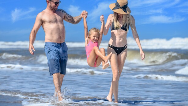A family on a beach with waves in the background. - San Lameer Villa Rentals 2818 (Southbroom)