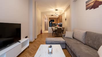 Deluxe Apartment, 2 Bedrooms, 2 Bathrooms | Living area | 43-inch Smart TV with cable channels, TV
