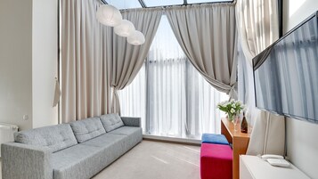 Habitación Deluxe | Sistema de insonorización, tabla de planchar con plancha, cuna de viaje