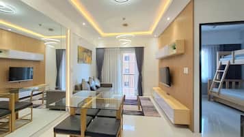 Luxury Apartment, 3 Bedrooms | Living area | 42-inch TV with cable channels
