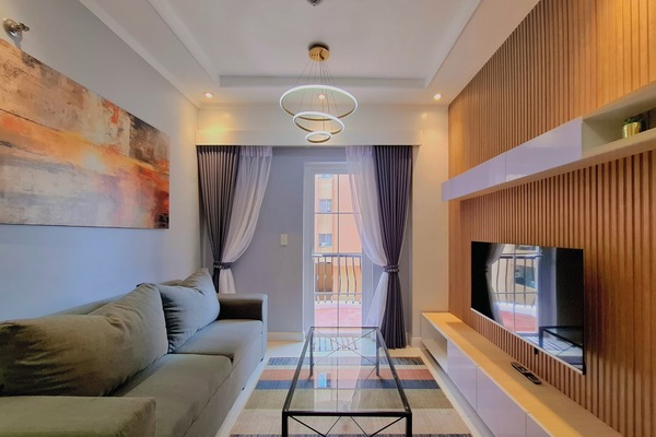 Apartamento superluxo, 3 quartos | Área de estar | TV 42 polegadas com canais a cabo