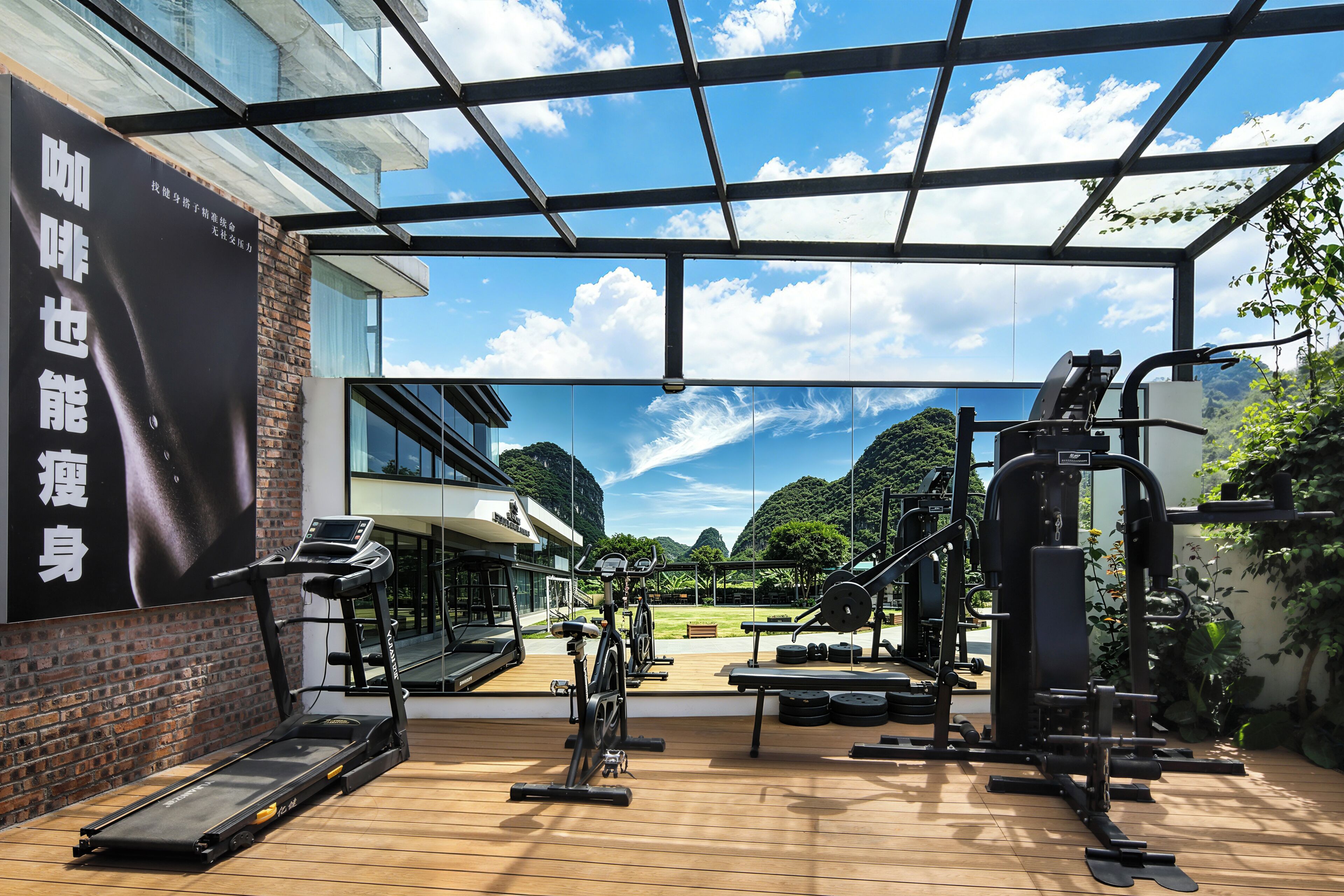 A gym with treadmills, weight machines, and a large outdoor view.