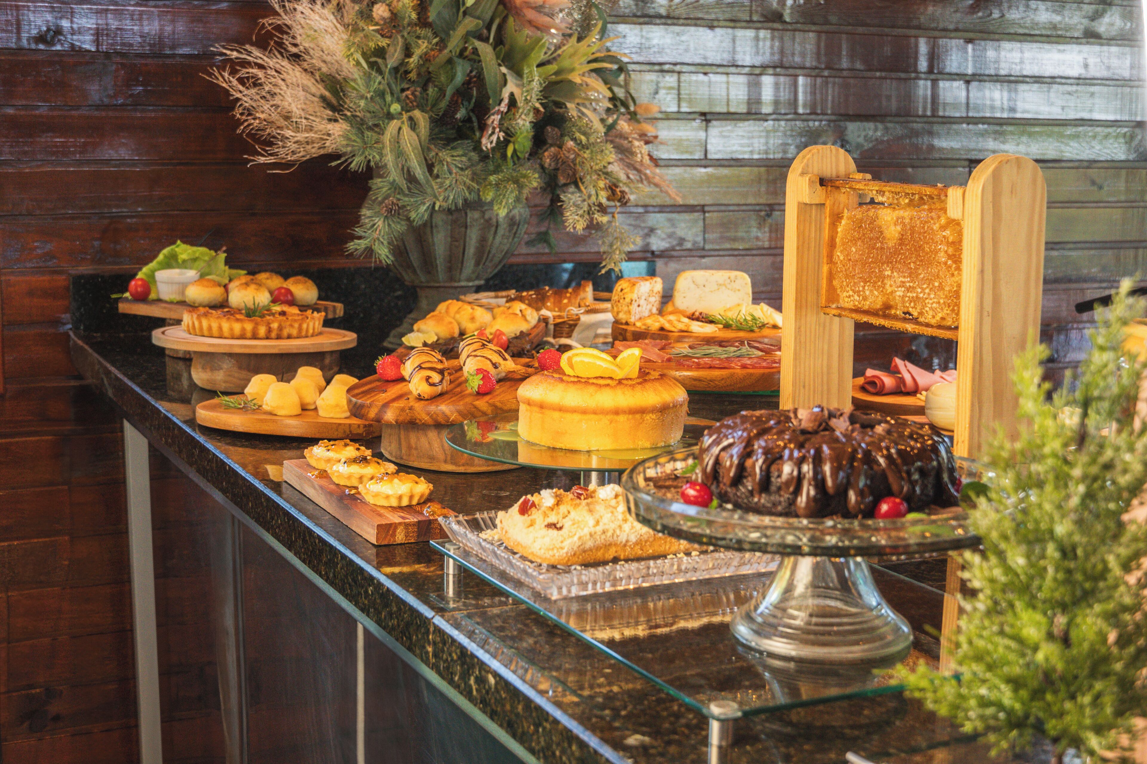 A buffet with various desserts and a honeycomb display.