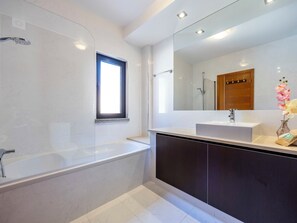 Bathtub, hair dryer, towels