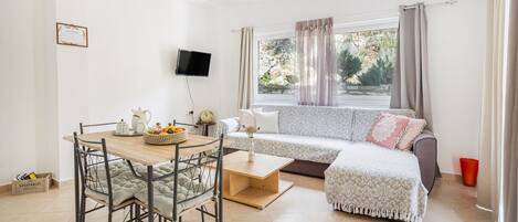 Villa Iris with Private pool, Panoramic Mountain Views | Living room | 42-inch LCD TV with satellite channels, TV