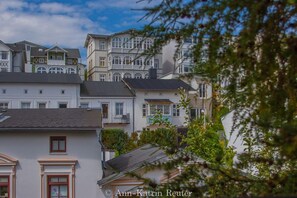 Rows of historic buildings with ornate detailing and large windows, offering a glimpse into the past.