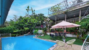 Outdoor pool, open 6:00 AM to 10:00 PM, pool umbrellas, sun loungers - CALI HILL RESORT & SPA (Phu Quoc)