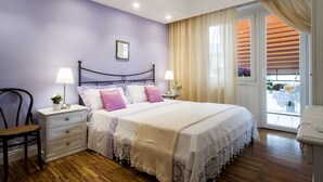 A bedroom with a bed, nightstands, a chair, and a window with curtains. - Roma-Incantata, Central, Large Balcony, Next to the main Subway,(Metro A), Park (Roma)