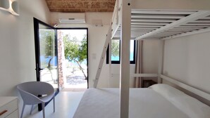 A modern room with a bed, a chair, and a view of the outdoors. - Villa Marinus- Private Pool And Breathtaking Sea View (Corsano)