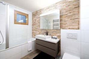 Bathtub, hair dryer, towels