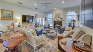 A spacious living room with a fireplace, comfortable seating, and a television. - 'The Crown Goose' - Bullard Home w/ Pool & Spa! (Bullard)