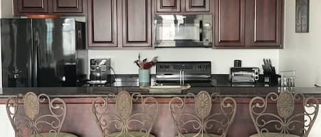 Coffee/tea maker, fridge, microwave, oven