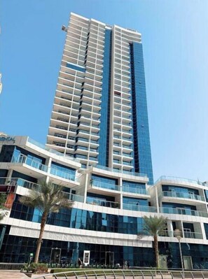 Standing tall in the heart of the city, this high-rise building offers stunning views from its spacious balconies.