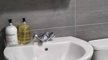 Hair dryer, towels, soap, shampoo