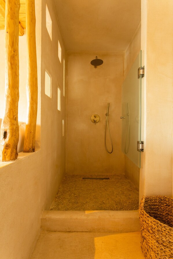 A shower with a glass door, a wooden bench, and a small basket. - Meli Suites Isle - Adults Only (Thasos)