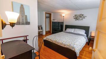 1 bedroom, desk, iron/ironing board, travel crib