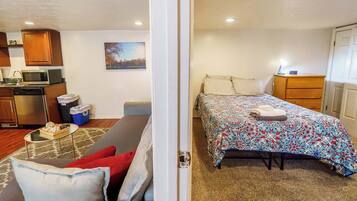 1 bedroom, desk, iron/ironing board, travel crib