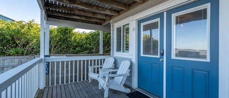 First floor porch with chairs to enjoy a coffee or wine with the sunset!