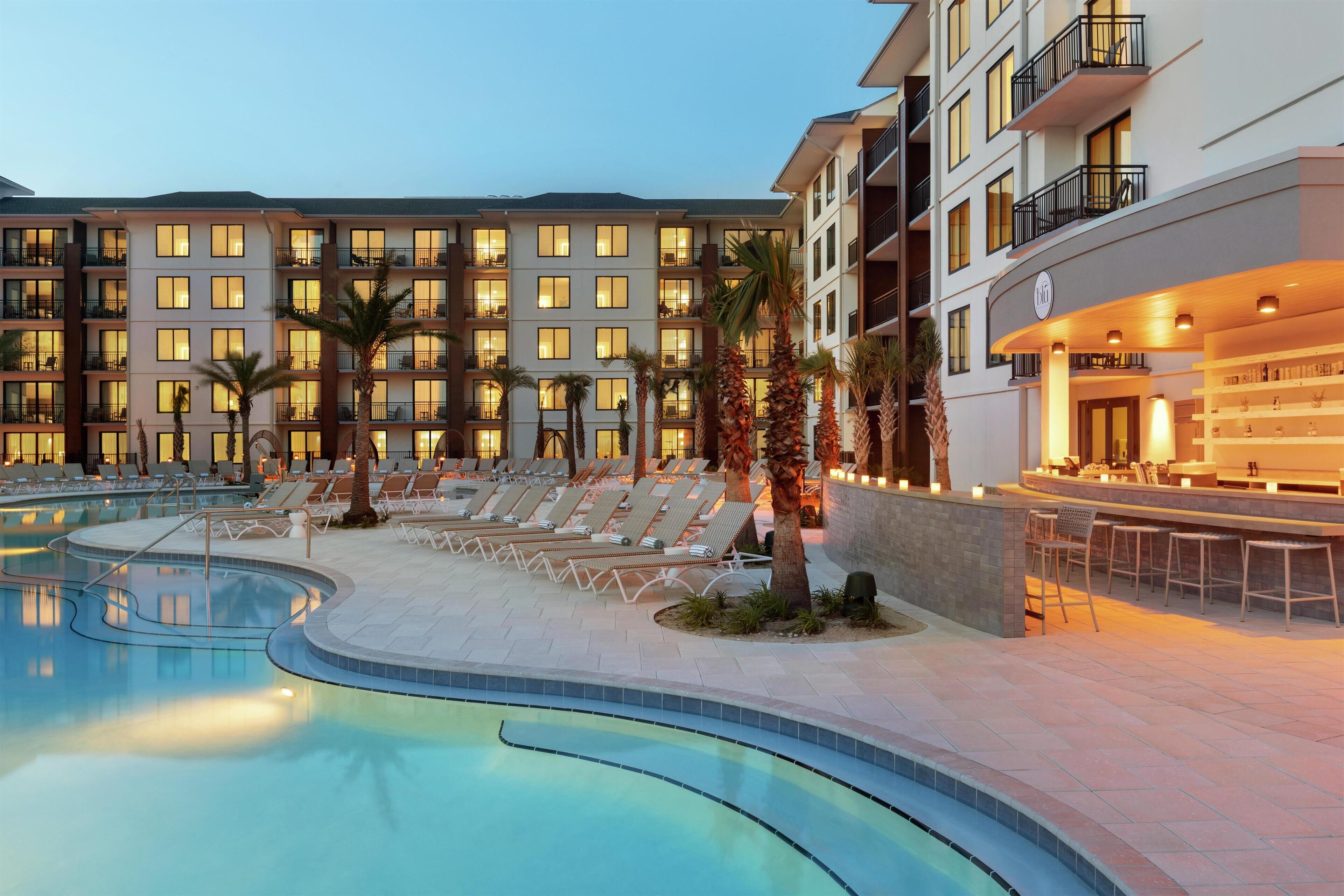 Outdoor pool, open 8:00 AM to 5:00 PM, pool umbrellas